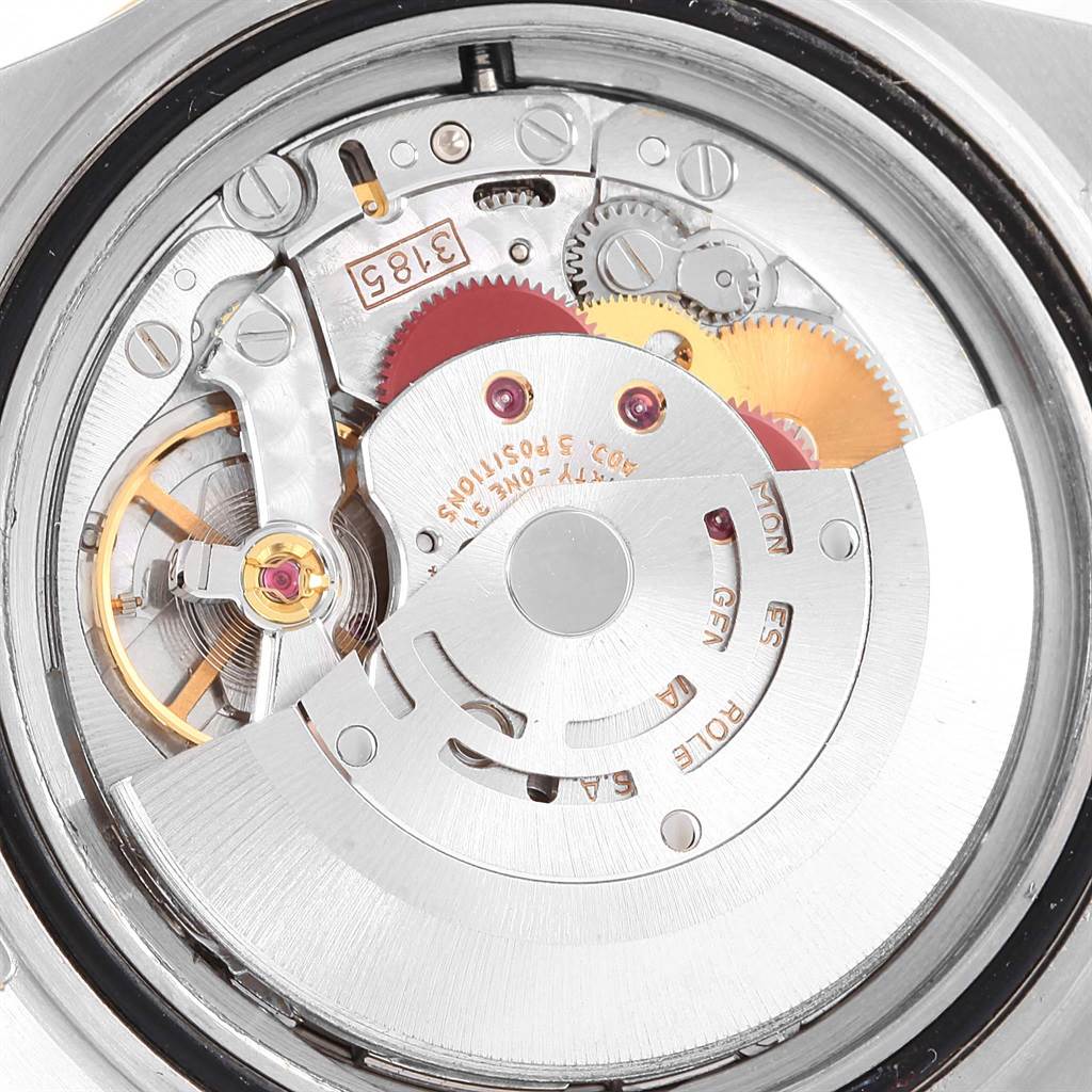This is a close-up of the movement mechanism inside the Rolex GMT-Master 16713 Men's Stainless Steel Silver Dial 16713 Men's Stainless Steel Silver Dial watch, showing gears and the rotor.