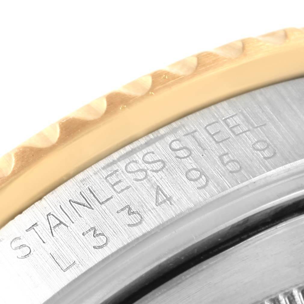 The image shows a close-up angle of the stainless steel case and bezel of a Rolex GMT-Master 16713 Men's Stainless Steel Silver Dial 16713 Men's Stainless Steel Silver Dial watch, with engraved text visible.