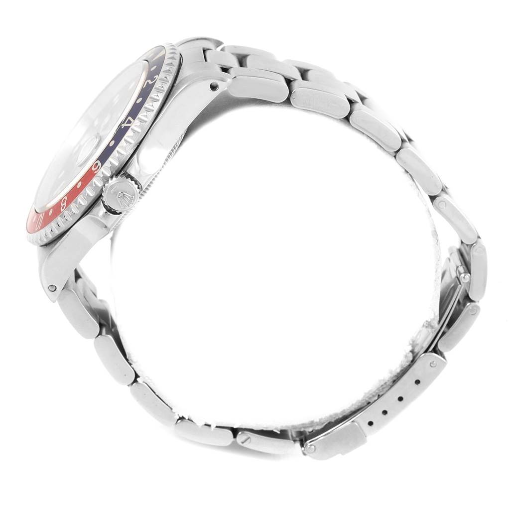 The image shows a side view of a Rolex GMT-Master 16700 Men's Stainless Steel Black Dial 16700 Men's Stainless Steel Black Dial watch, highlighting its bezel, crown, and stainless steel bracelet.