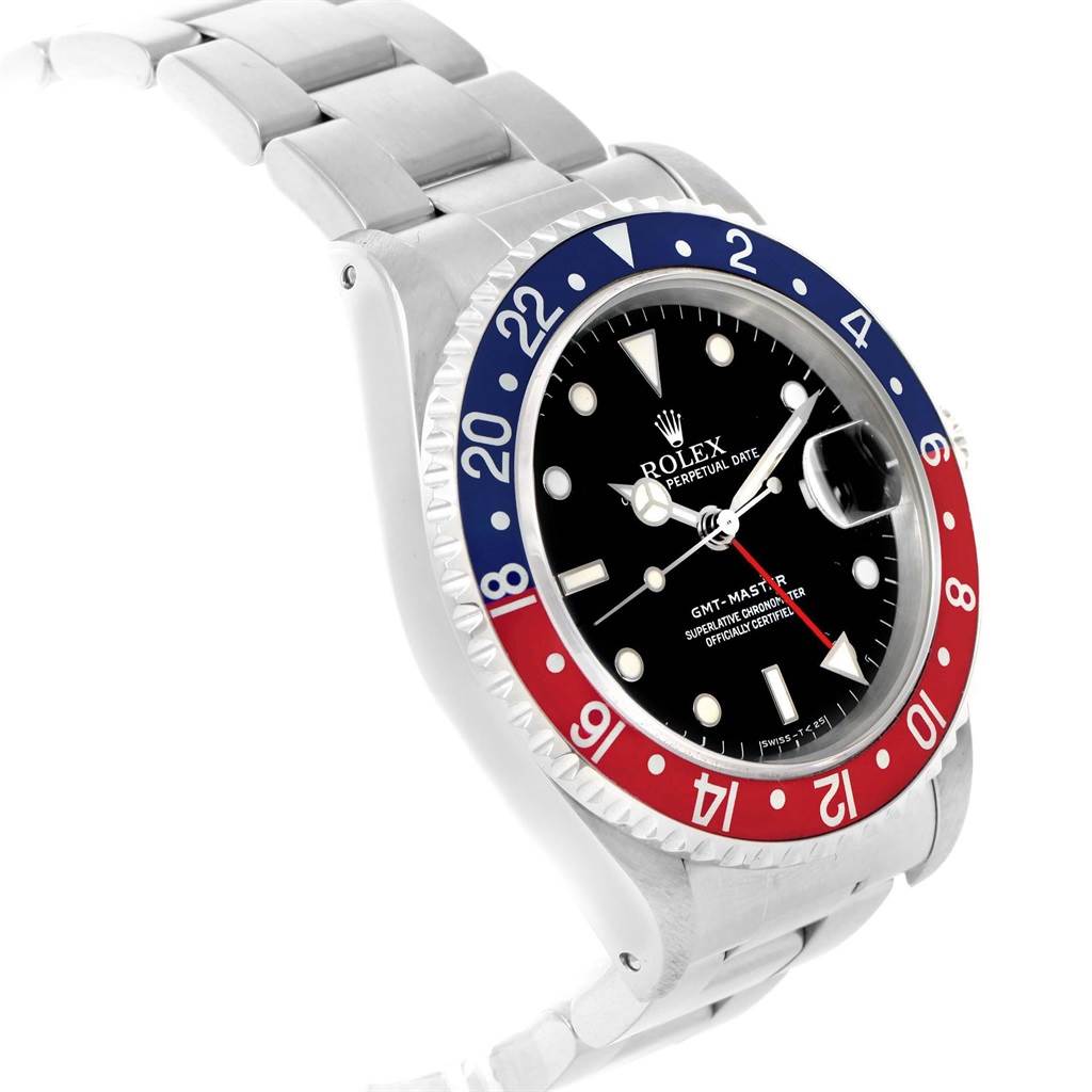 The image shows a Rolex GMT-Master 16700 Men's Stainless Steel Black Dial 16700 Men's Stainless Steel Black Dial watch angled from the top left, highlighting the bezel, face, and part of the bracelet.