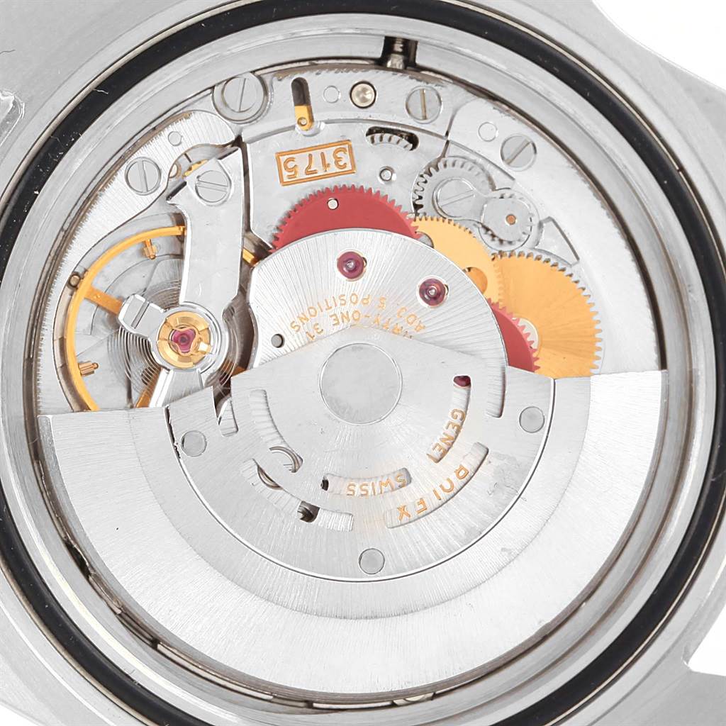 The image shows a close-up view of the inner mechanism of a Rolex GMT-Master 16700 Men's Stainless Steel Black Dial 16700 Men's Stainless Steel Black Dial watch, highlighting gears and the rotor.