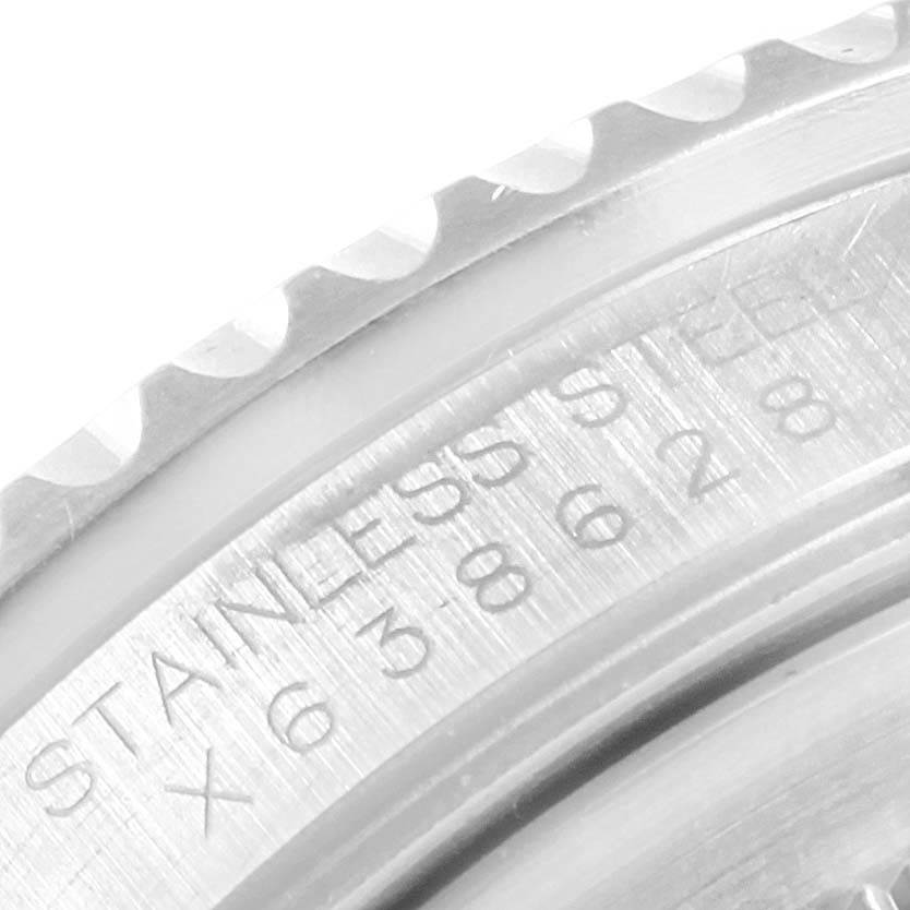 This close-up image shows the engraved bezel and case of a Rolex GMT-Master 16700 Men's Stainless Steel Black Dial 16700 Men's Stainless Steel Black Dial watch, highlighting the "Stainless Steel" inscription.