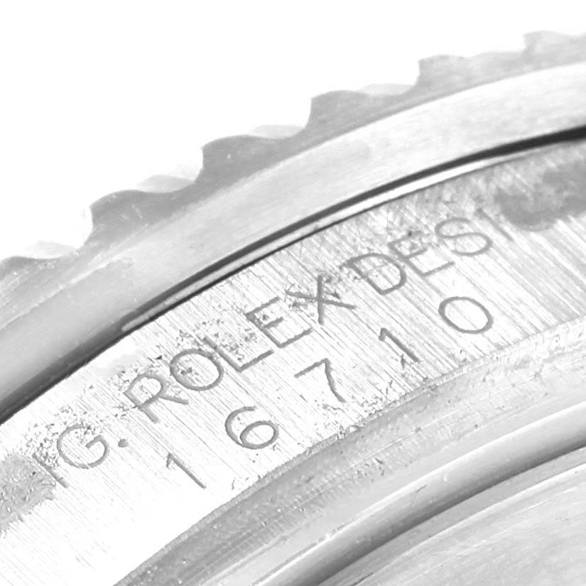 This image shows a close-up angle of the case back, focusing on the engraved text of the Rolex GMT-Master 16710 Men's Stainless Steel Black Dial 16710 Men's Stainless Steel Black Dial with the reference number 16710.
