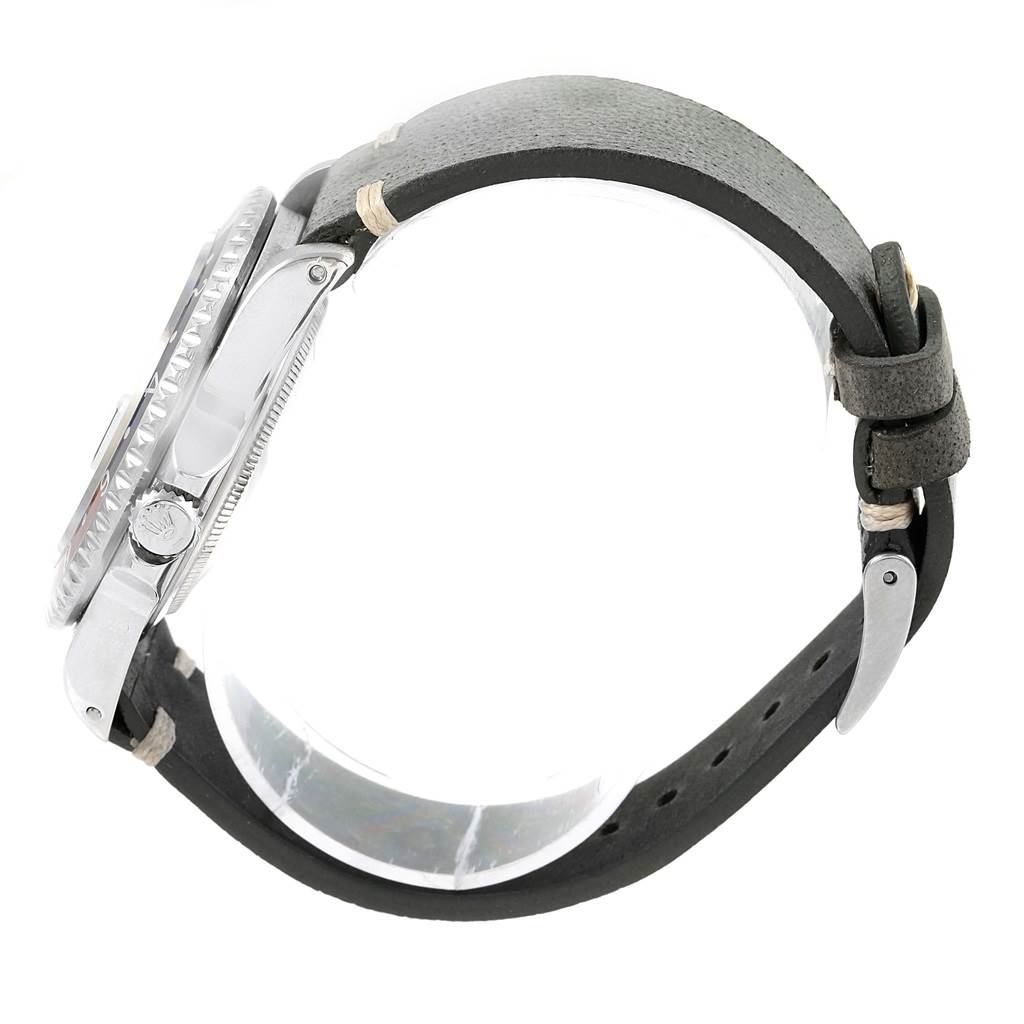 This side view of the Rolex GMT-Master 16710 Men's Stainless Steel Black Dial 16710 Men's Stainless Steel Black Dial watch shows the bezel, case, crown, and strap.