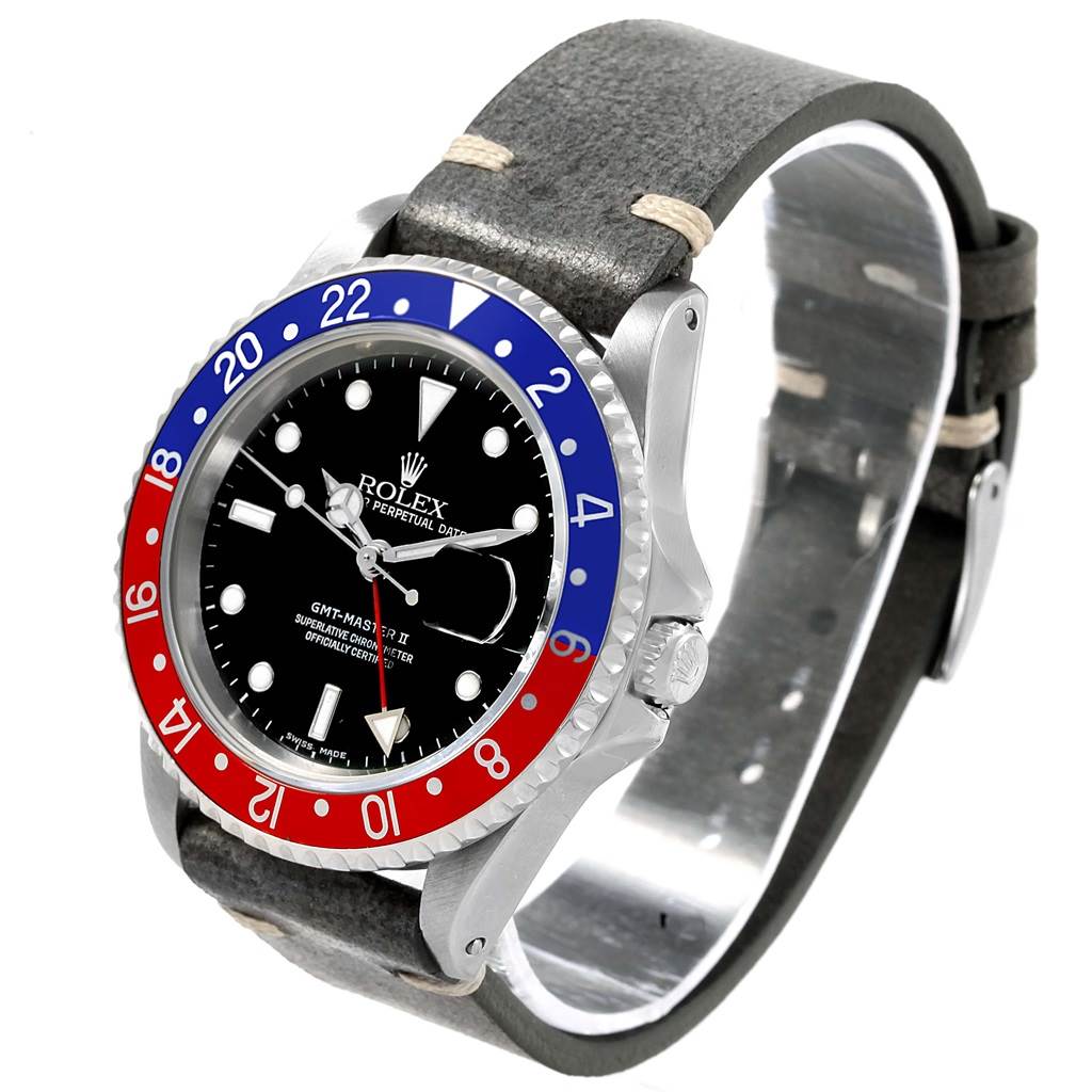 The image shows a Rolex GMT-Master 16710 Men's Stainless Steel Black Dial 16710 Men's Stainless Steel Black Dial watch from an oblique angle, highlighting its bezel, dial, and leather strap.