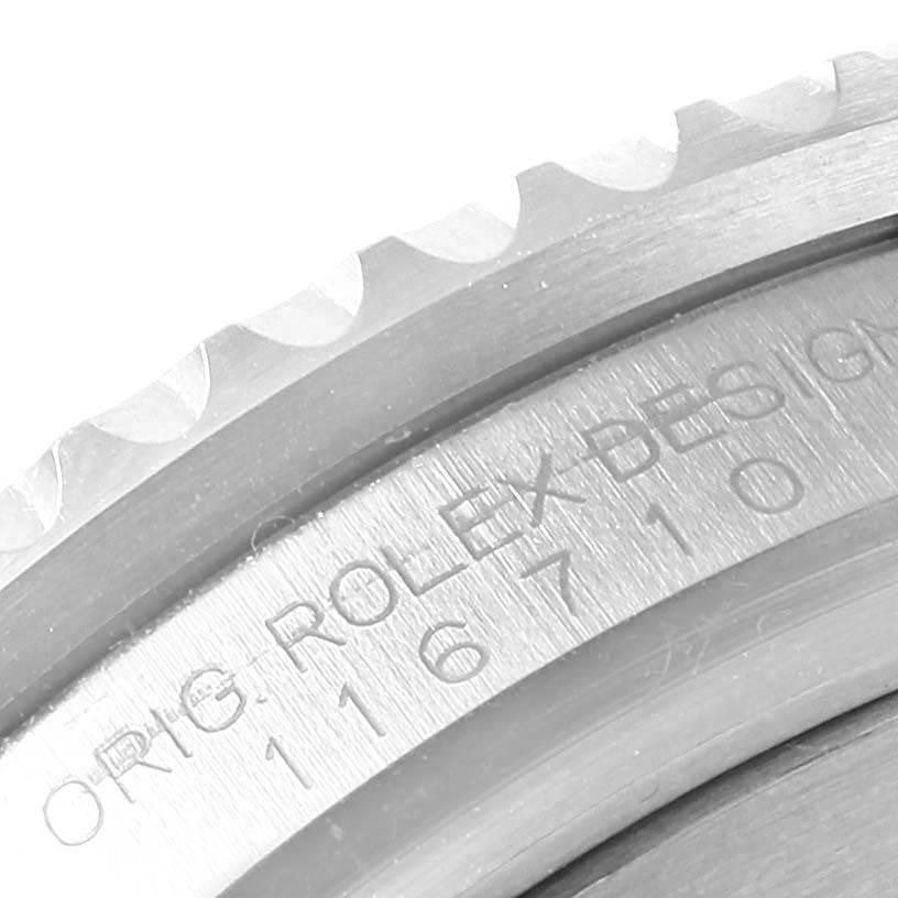 The image shows a close-up of the case and bezel of a Rolex GMT-Master 116710 Men
s Stainless Steel Black Dial 116710 Men
s Stainless Steel Black Dial, highlighting the model number and "ROLEX DESIGN" engraving.