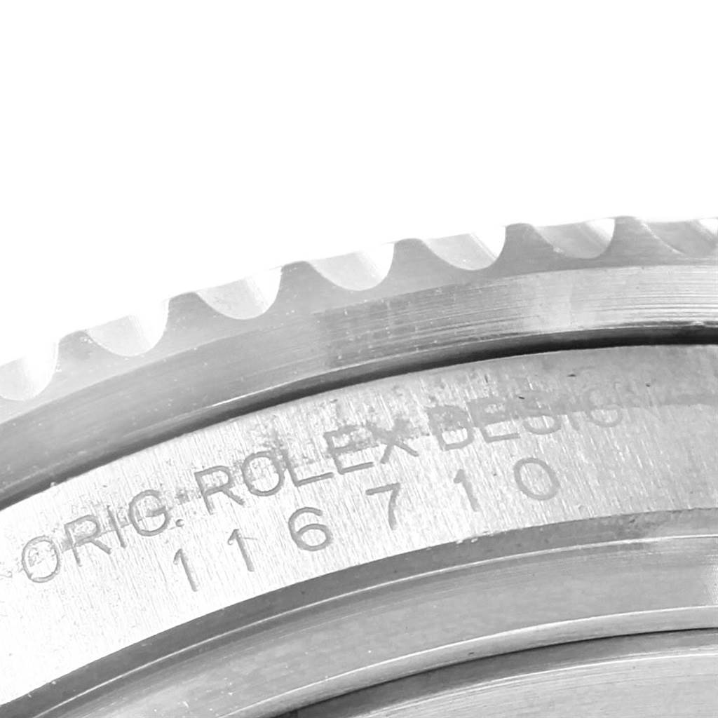 The image shows a close-up of the side of the case and bezel of a Rolex GMT-Master 116710 Men
s Stainless Steel Black Dial 116710 Men
s Stainless Steel Black Dial watch, highlighting its engraved model number.