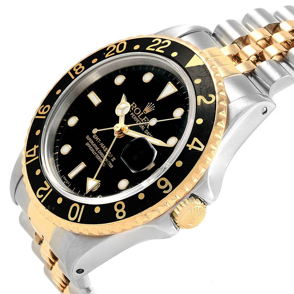 The Rolex GMT-Master 16713 Men's Stainless Steel Black Dial 16713 Men's Stainless Steel Black Dial watch is shown at an angled view displaying the face, bezel, crown, and part of the bracelet.