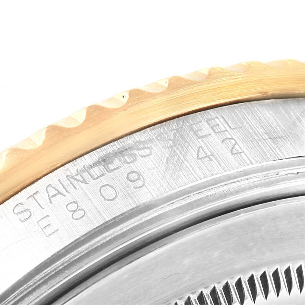 This close-up image shows the side profile and the engravings on the case back of a Rolex GMT-Master 16713 Men's Stainless Steel Black Dial 16713 Men's Stainless Steel Black Dial watch.