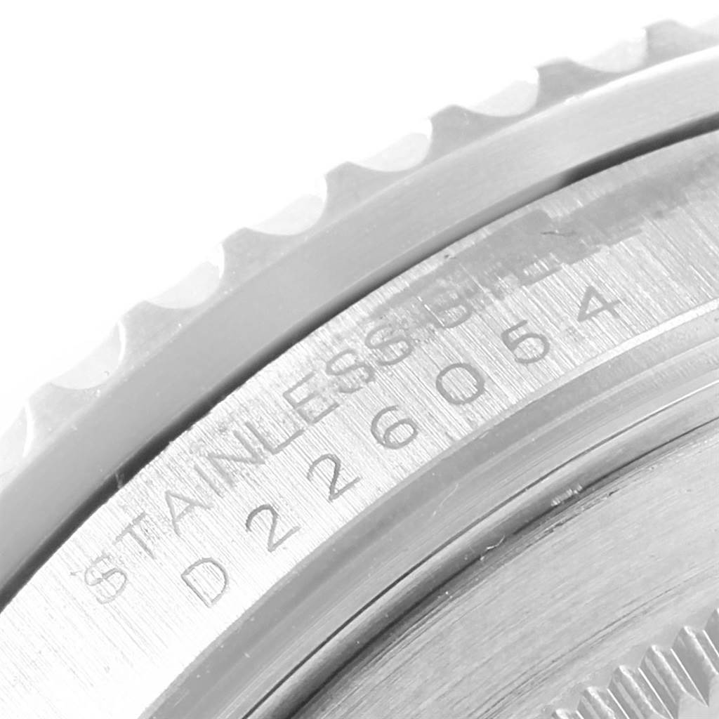 The image shows a close-up of the case side and bezel of a Rolex GMT-Master 16710 Men's Stainless Steel Black Dial 16710 Men's Stainless Steel Black Dial, highlighting the engraved model and serial number.