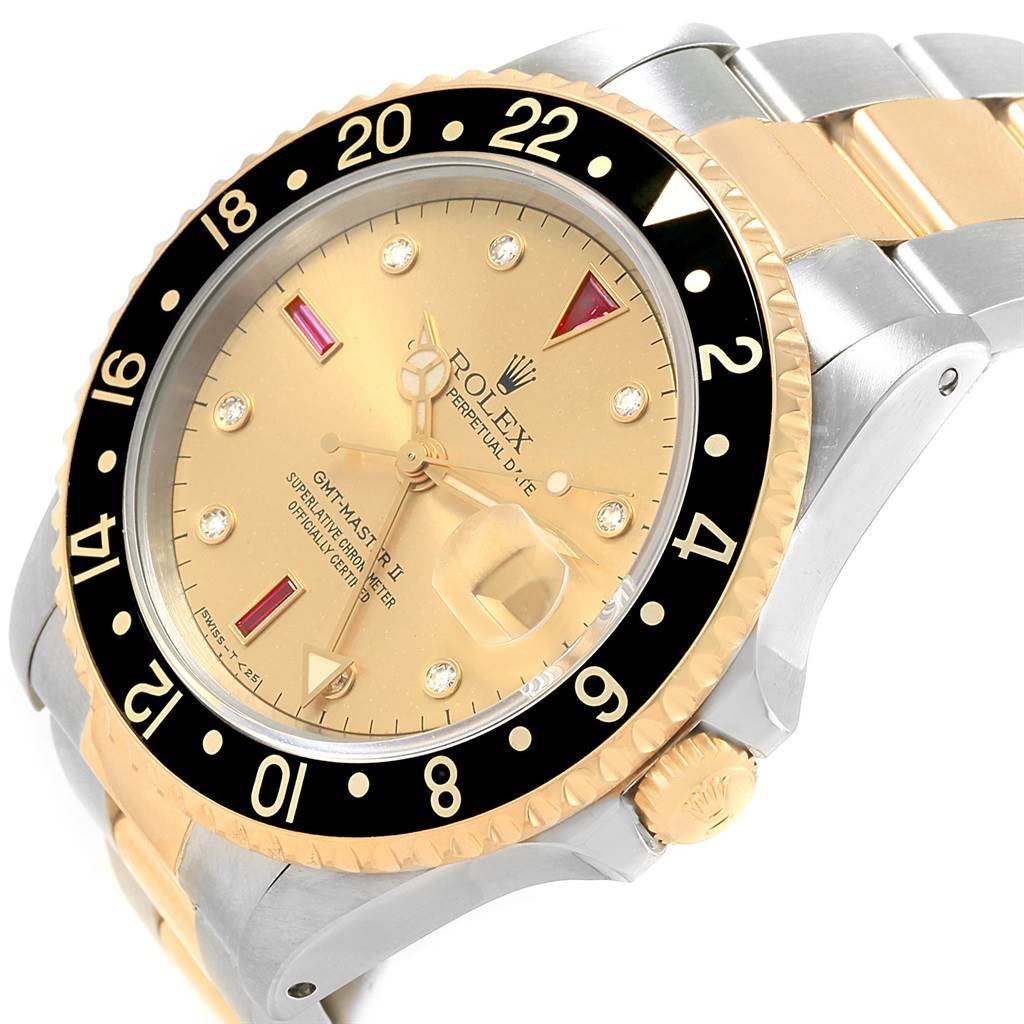 The Rolex GMT-Master 16713 Men's Stainless Steel Champagne Dial 16713 Men's Stainless Steel Champagne Dial II watch is shown at an angle showcasing the bezel, dial, crown, and parts of the bracelet.
