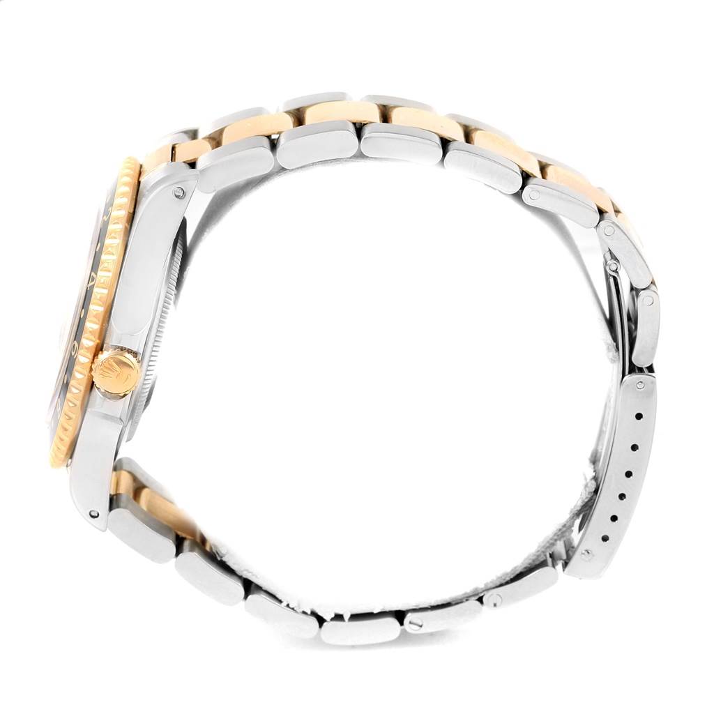 The image shows a side view of a Rolex GMT-Master 16713 Men's Stainless Steel Champagne Dial 16713 Men's Stainless Steel Champagne Dial watch, highlighting the bezel, crown, and part of the bracelet.