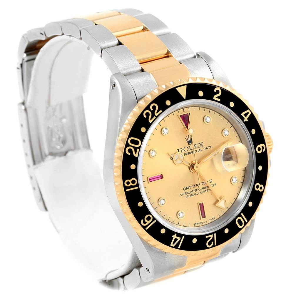 The Rolex GMT-Master 16713 Men's Stainless Steel Champagne Dial 16713 Men's Stainless Steel Champagne Dial watch is shown at an angle offering a clear view of the face, bezel, and partial bracelet.