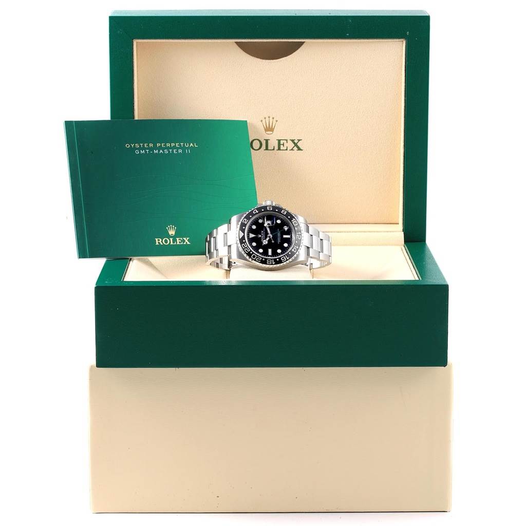 This image shows a Rolex GMT-Master 116710 Men's Stainless Steel Black Dial 116710 Men's Stainless Steel Black Dial II watch from a front angle, displayed in its open box with accompanying manual.