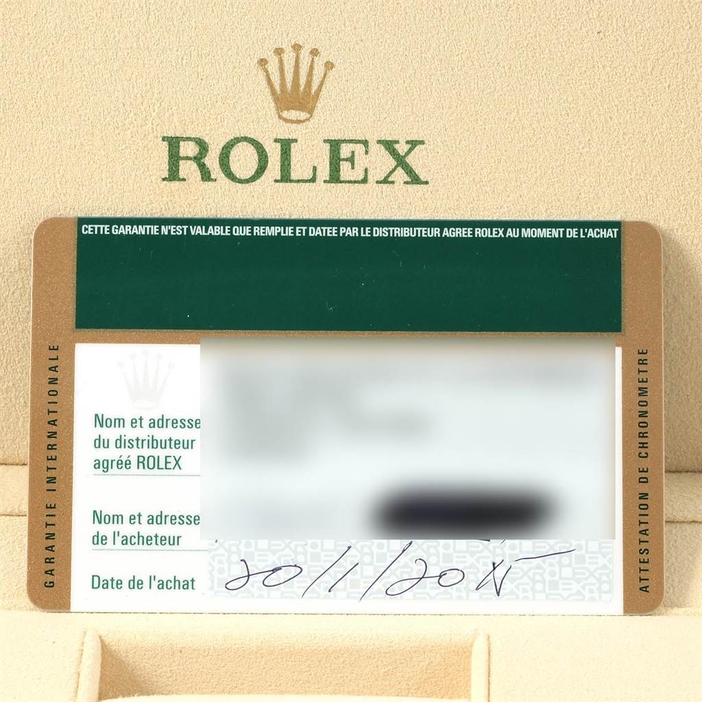 The image shows a Rolex GMT-Master 116710 Men's Stainless Steel Black Dial 116710 Men's Stainless Steel Black Dial warranty card placed inside a box with the Rolex logo visible above it.