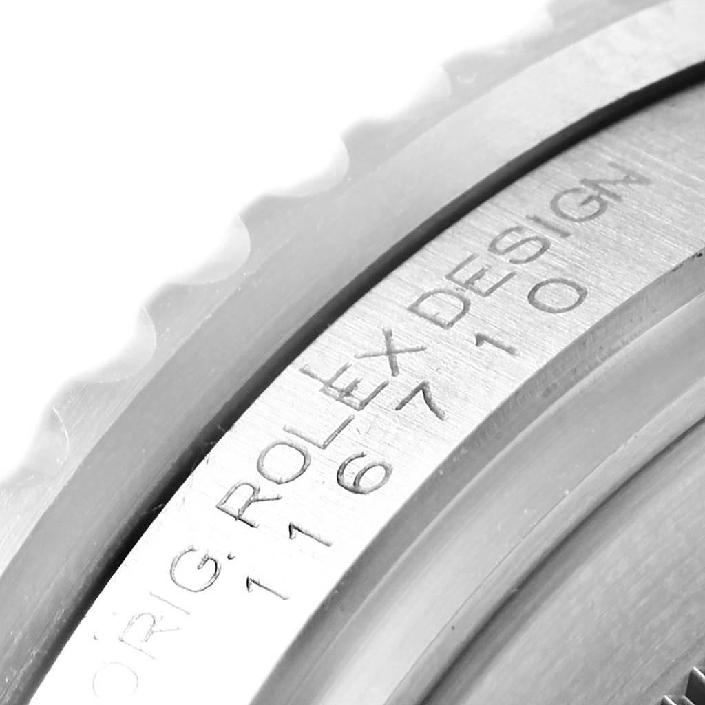 This close-up image shows the bezel and rehaut ring with engraved text on a Rolex GMT-Master 116710 Men's Stainless Steel Black Dial 116710 Men's Stainless Steel Black Dial watch.