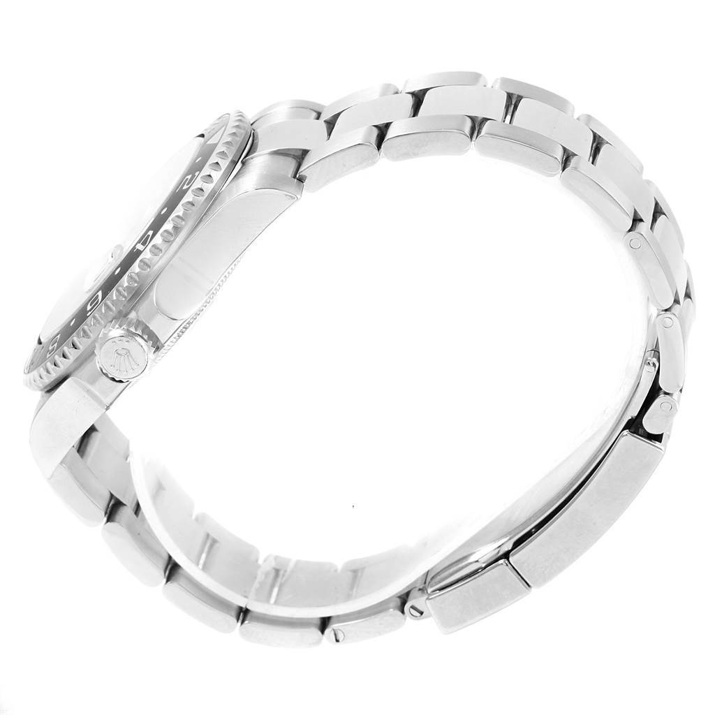 The image shows a side view of a Rolex GMT-Master 116710 Men
s Stainless Steel Black Dial 116710 Men
s Stainless Steel Black Dial, highlighting its bezel, crown, and bracelet.