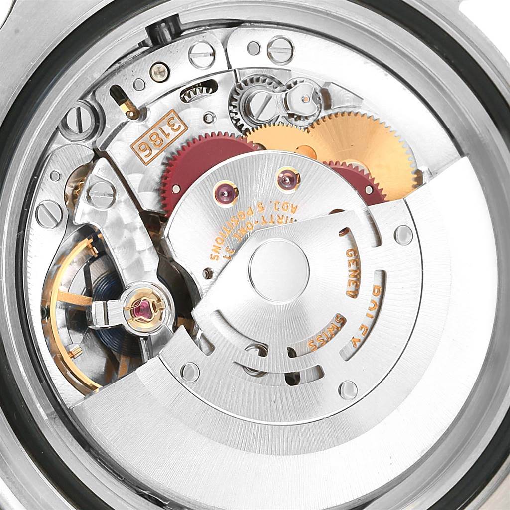 This image shows the intricate internal movement components of a Rolex GMT-Master 116710 Men
s Stainless Steel Black Dial 116710 Men
s Stainless Steel Black Dial watch from a top-down perspective.