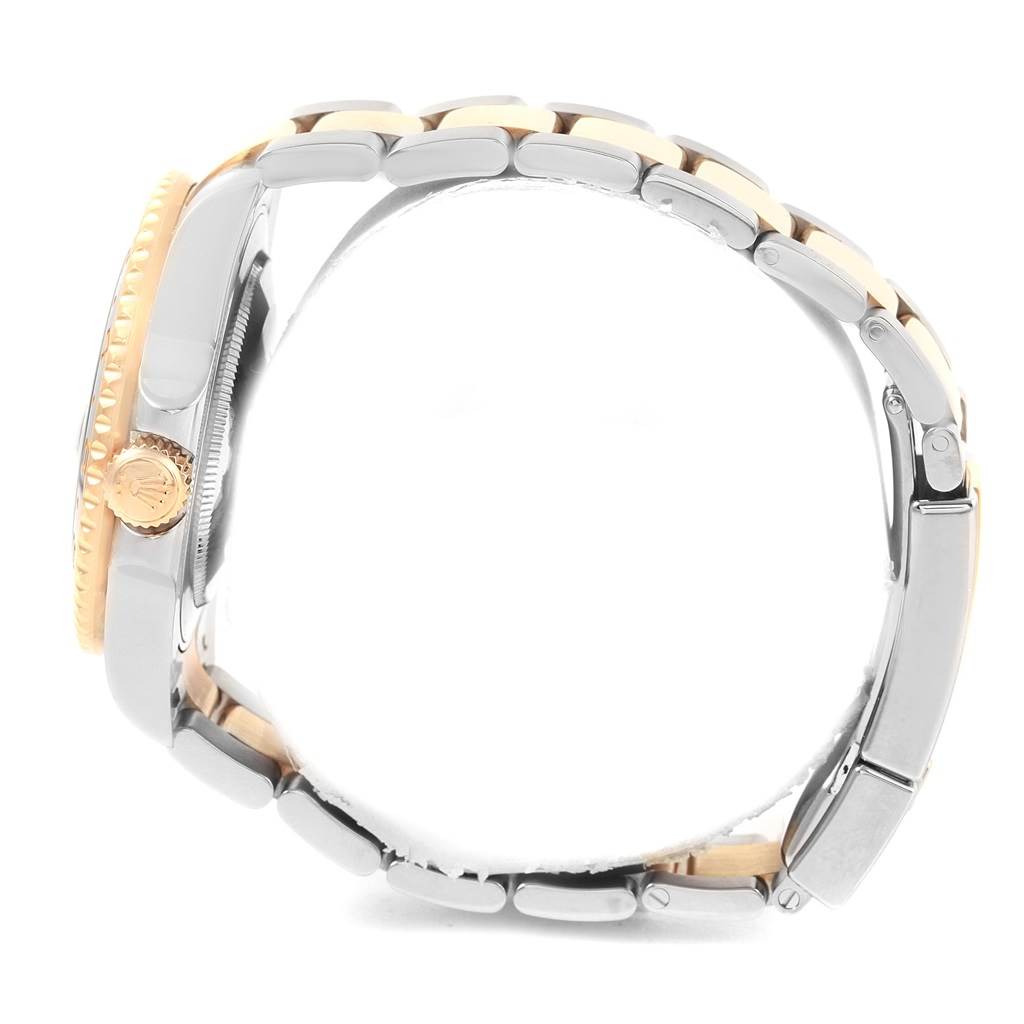 The image shows a side profile of the Rolex GMT-Master 116713 Men
s Stainless Steel Black Dial 116713 Men
s Stainless Steel Black Dial watch highlighting the bracelet, crown, and part of the bezel.