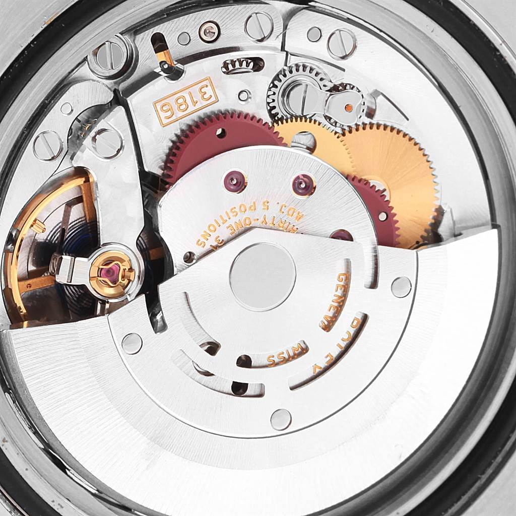 This image shows a close-up of the movement mechanism of a Rolex GMT-Master 116713 Men
s Stainless Steel Black Dial 116713 Men
s Stainless Steel Black Dial watch.