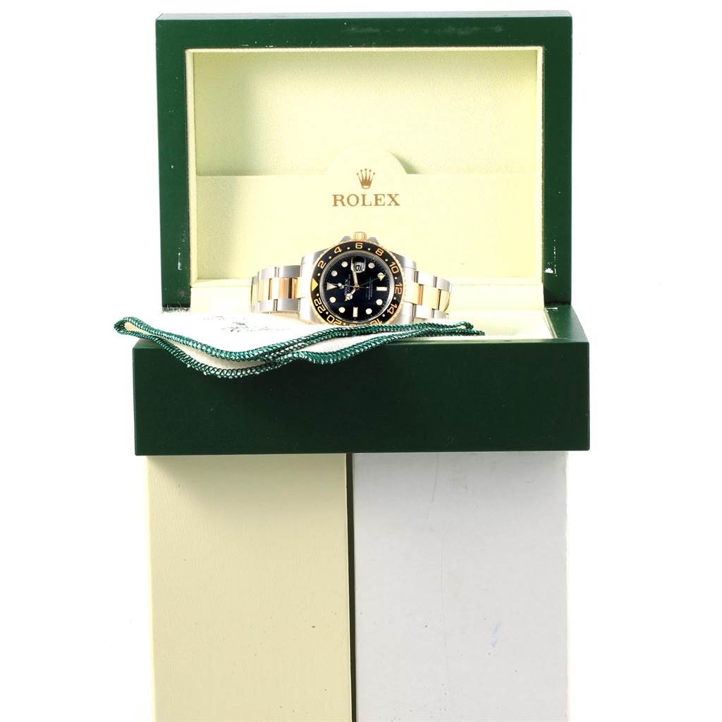 The image shows a Rolex GMT-Master 116713 Men
s Stainless Steel Black Dial 116713 Men
s Stainless Steel Black Dial watch with its bracelet, presented inside an open brand box.