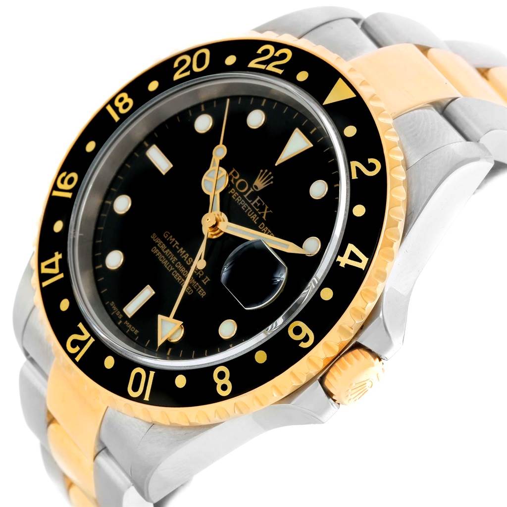 The image shows a close-up view of the Rolex GMT-Master 16713 Men's Stainless Steel Black Dial 16713 Men's Stainless Steel Black Dial watch, highlighting its bezel, dial, and partially visible bracelet.