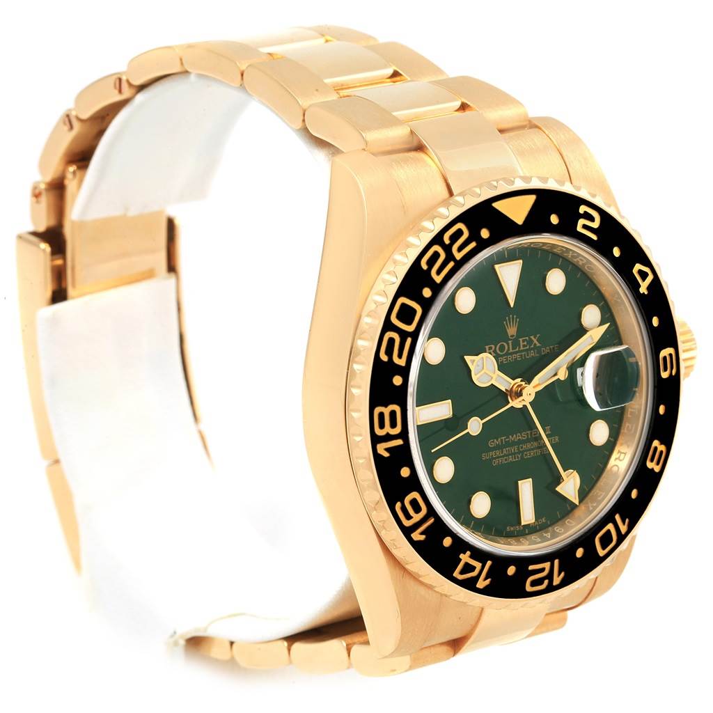The image shows a Rolex GMT-Master 116718 Men's Yellow Gold Green Dial 116718 Men's Yellow Gold Green Dial watch angled to display its gold bracelet, black bezel, and green dial.