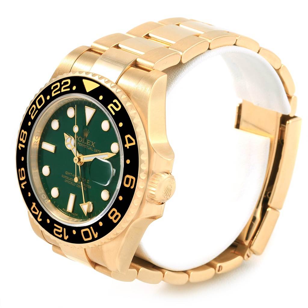 The image shows a Rolex GMT-Master 116718 Men's Yellow Gold Green Dial 116718 Men's Yellow Gold Green Dial watch angled to display its front dial, bezel, crown, and part of its bracelet.