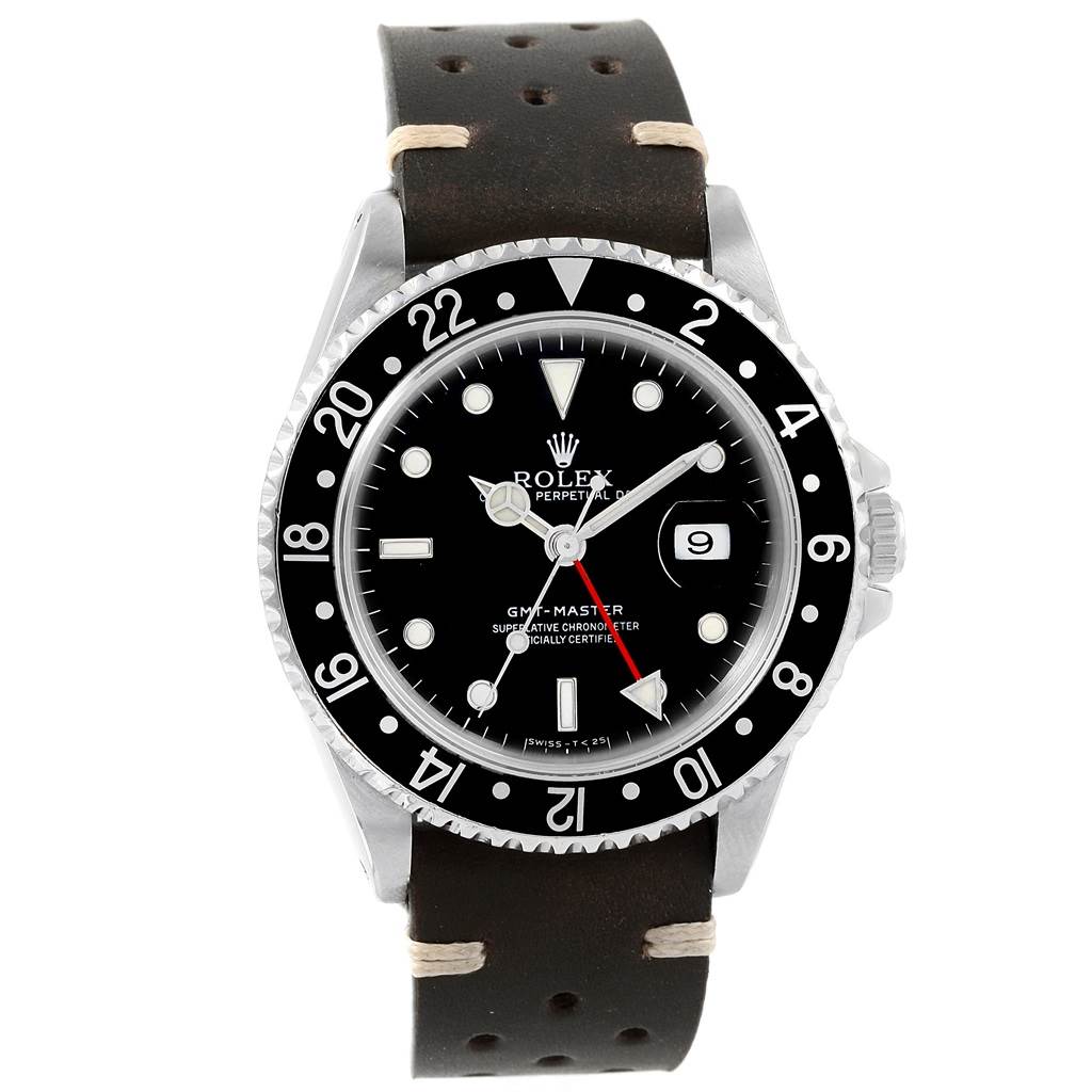 The image shows a frontal view of a Rolex GMT-Master 16700 Men's Stainless Steel Black Dial 16700 Men's Stainless Steel Black Dial watch, highlighting its black bezel, dial, and leather strap.