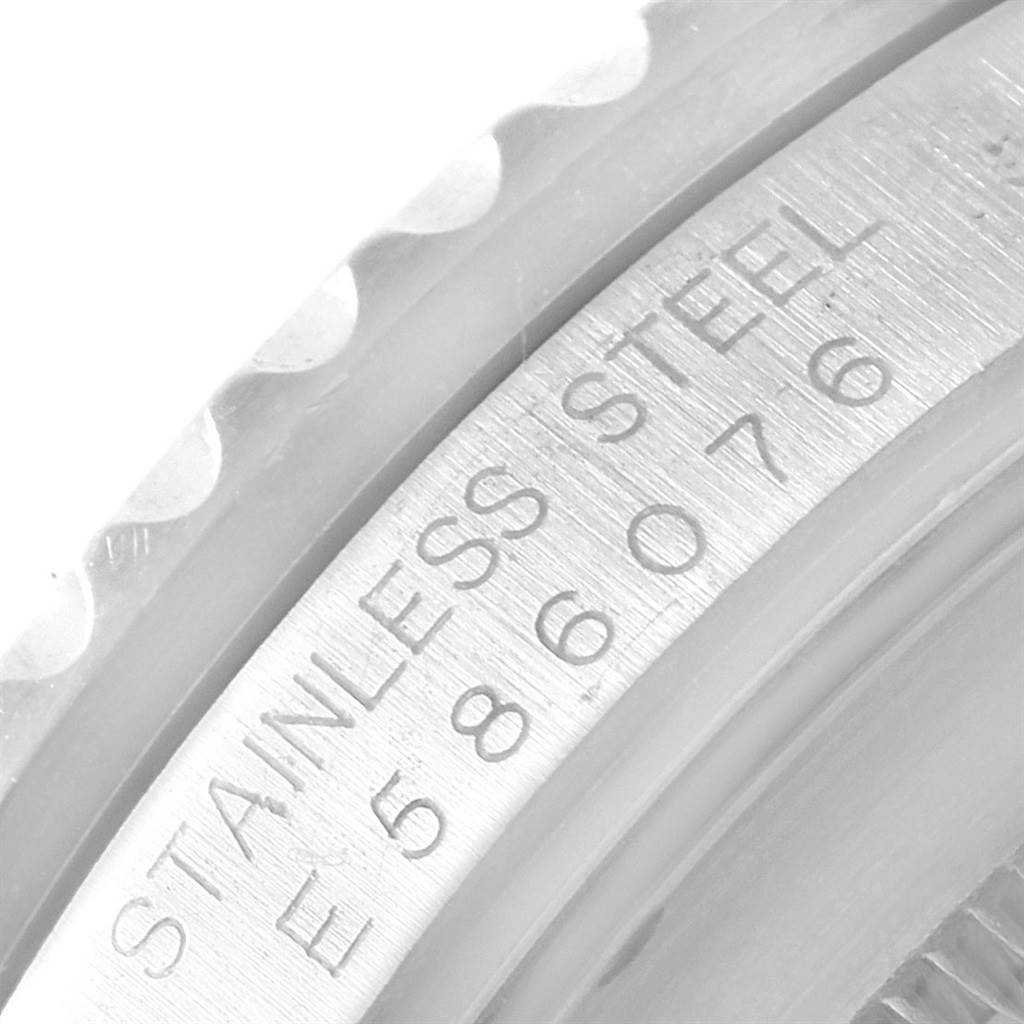 This close-up image shows the side view of the bezel and the engraved serial number of the Rolex GMT-Master 16700 Men's Stainless Steel Black Dial 16700 Men's Stainless Steel Black Dial watch.
