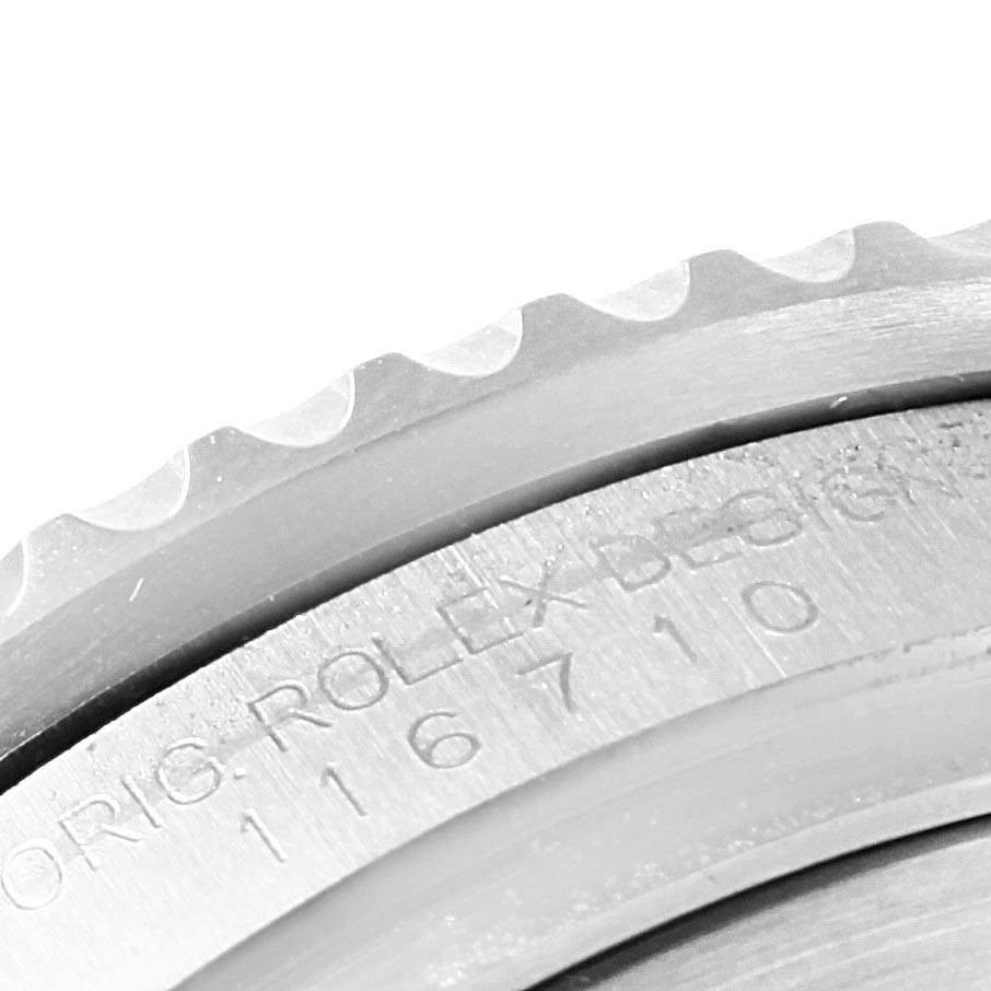 This image shows a close-up of the side view of the textured bezel and case of the Rolex GMT-Master 116710 Men's Stainless Steel Black Dial 116710 Men's Stainless Steel Black Dial, with model engravings visible.