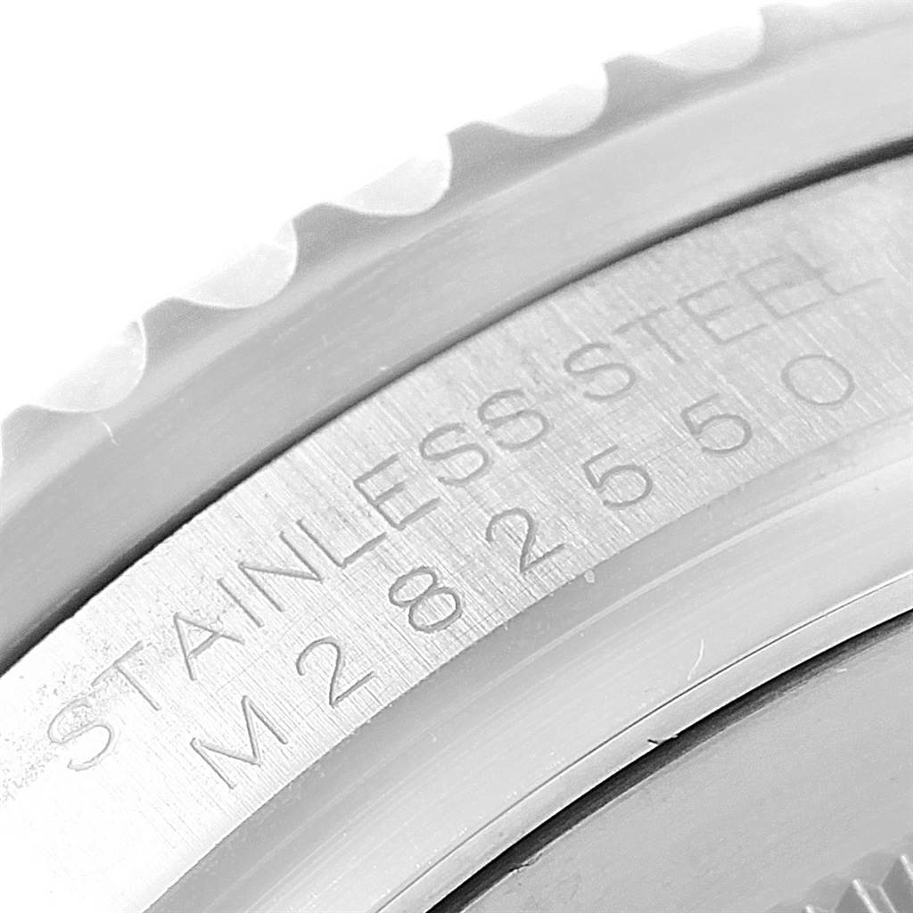 The image shows a close-up of the engraved stainless steel part of the casing of the Rolex GMT-Master 116710 Men's Stainless Steel Black Dial 116710 Men's Stainless Steel Black Dial watch.