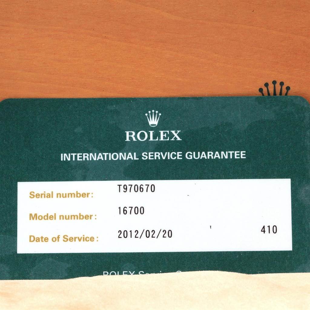 The image shows a Rolex GMT-Master 16700 Men's Stainless Steel Black Dial 16700 Men's Stainless Steel Black Dial service guarantee card with serial and model numbers.