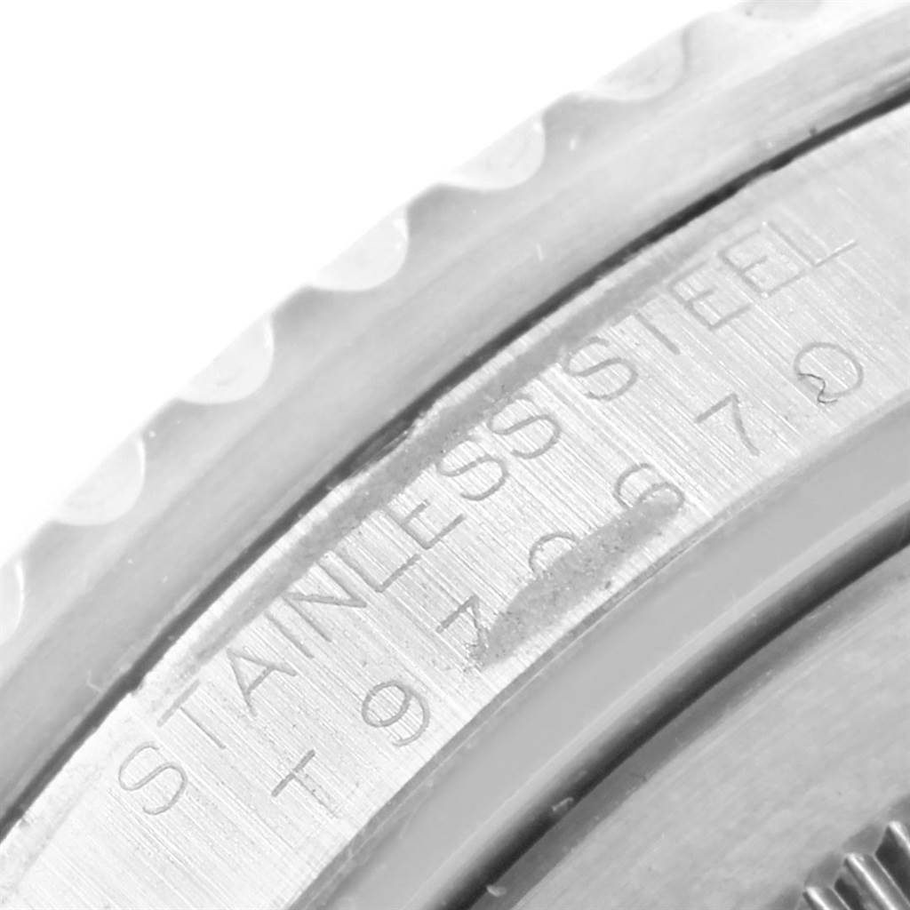 This image shows a close-up view of the stainless steel engravings on the bezel edge of a Rolex GMT-Master 16700 Men's Stainless Steel Black Dial 16700 Men's Stainless Steel Black Dial watch.