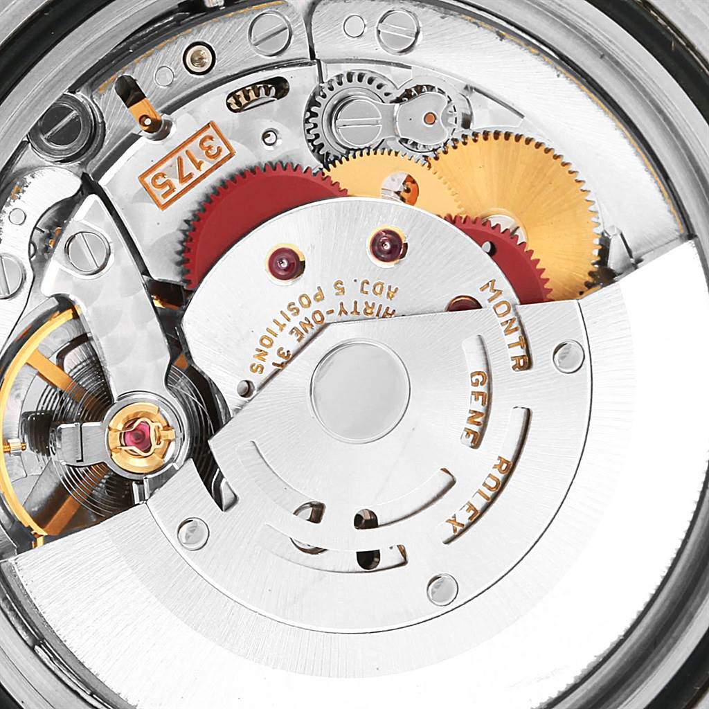 This close-up image shows the intricate internal mechanism of a Rolex GMT-Master 16700 Men's Stainless Steel Black Dial 16700 Men's Stainless Steel Black Dial watch.