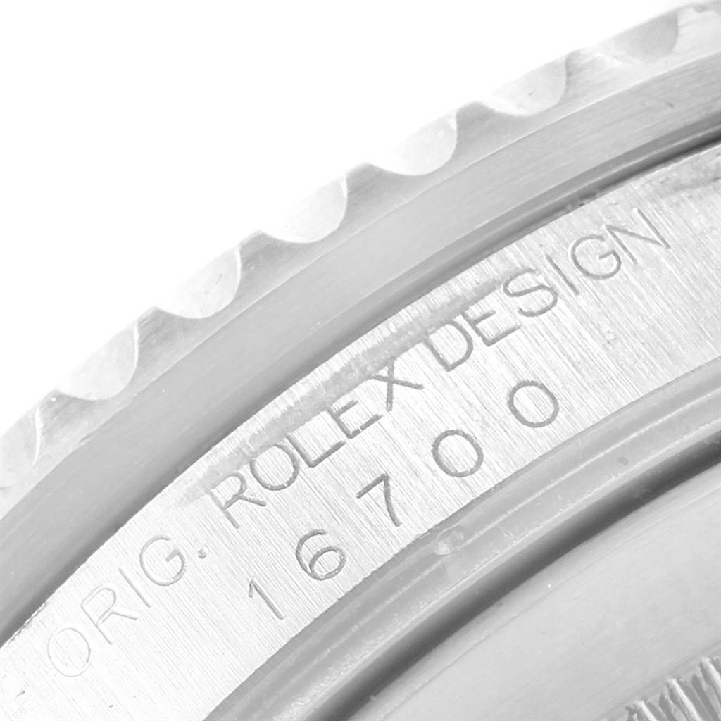 This image shows a close-up of the side case engraving on a Rolex GMT-Master 16700 Men's Stainless Steel Black Dial 16700 Men's Stainless Steel Black Dial model 16700.