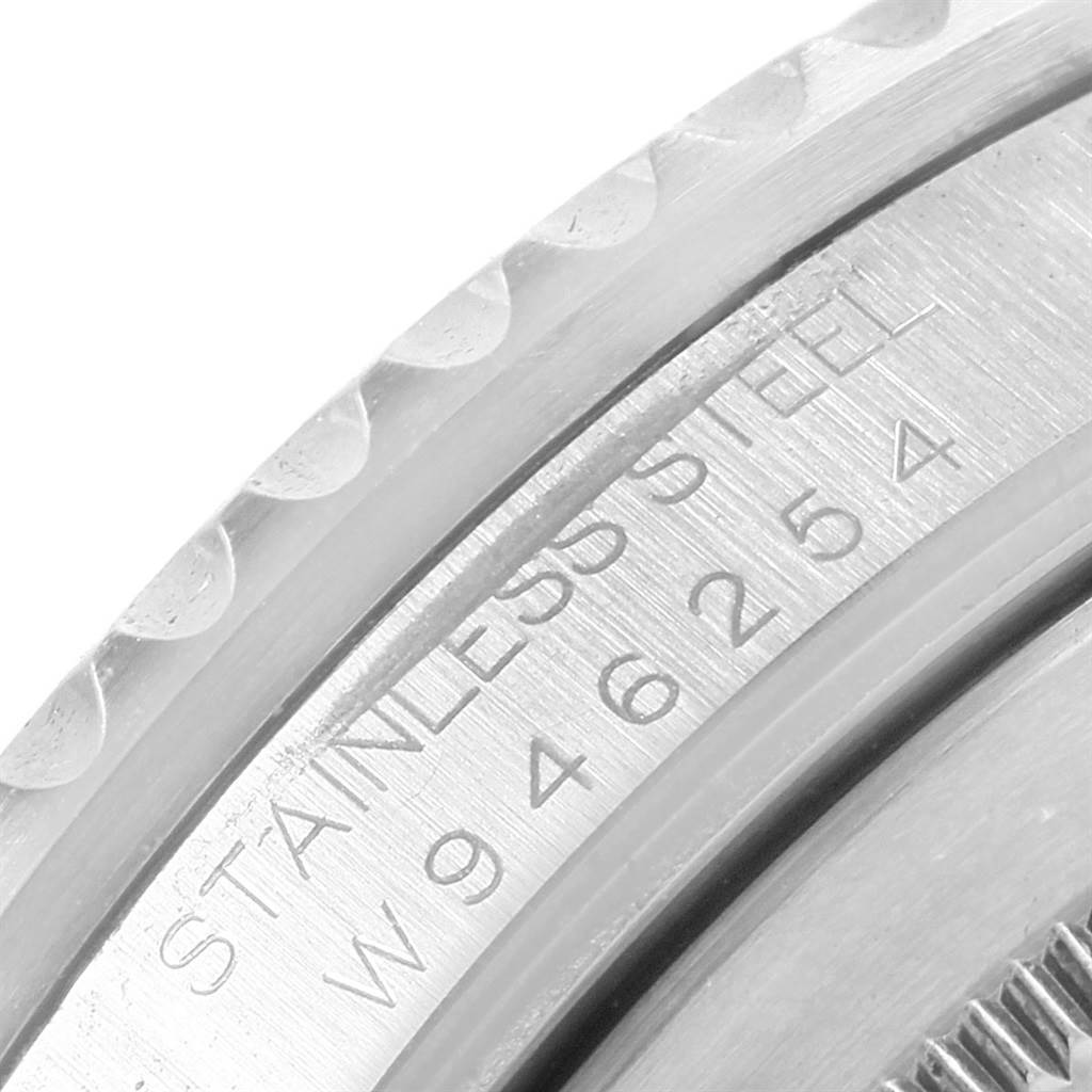 This close-up image shows the engraving on the case side of a Rolex GMT-Master 16700 Men's Stainless Steel Black Dial 16700 Men's Stainless Steel Black Dial watch, highlighting the stainless steel material and serial number.