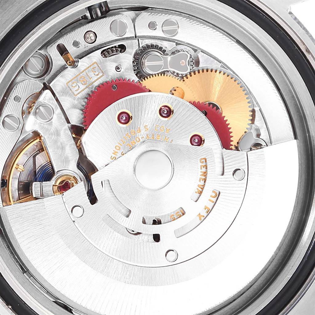 The image shows the movement mechanism of a Rolex GMT-Master 116713 Men
s Stainless Steel Black Dial 116713 Men
s Stainless Steel Black Dial watch from a macro internal angle.