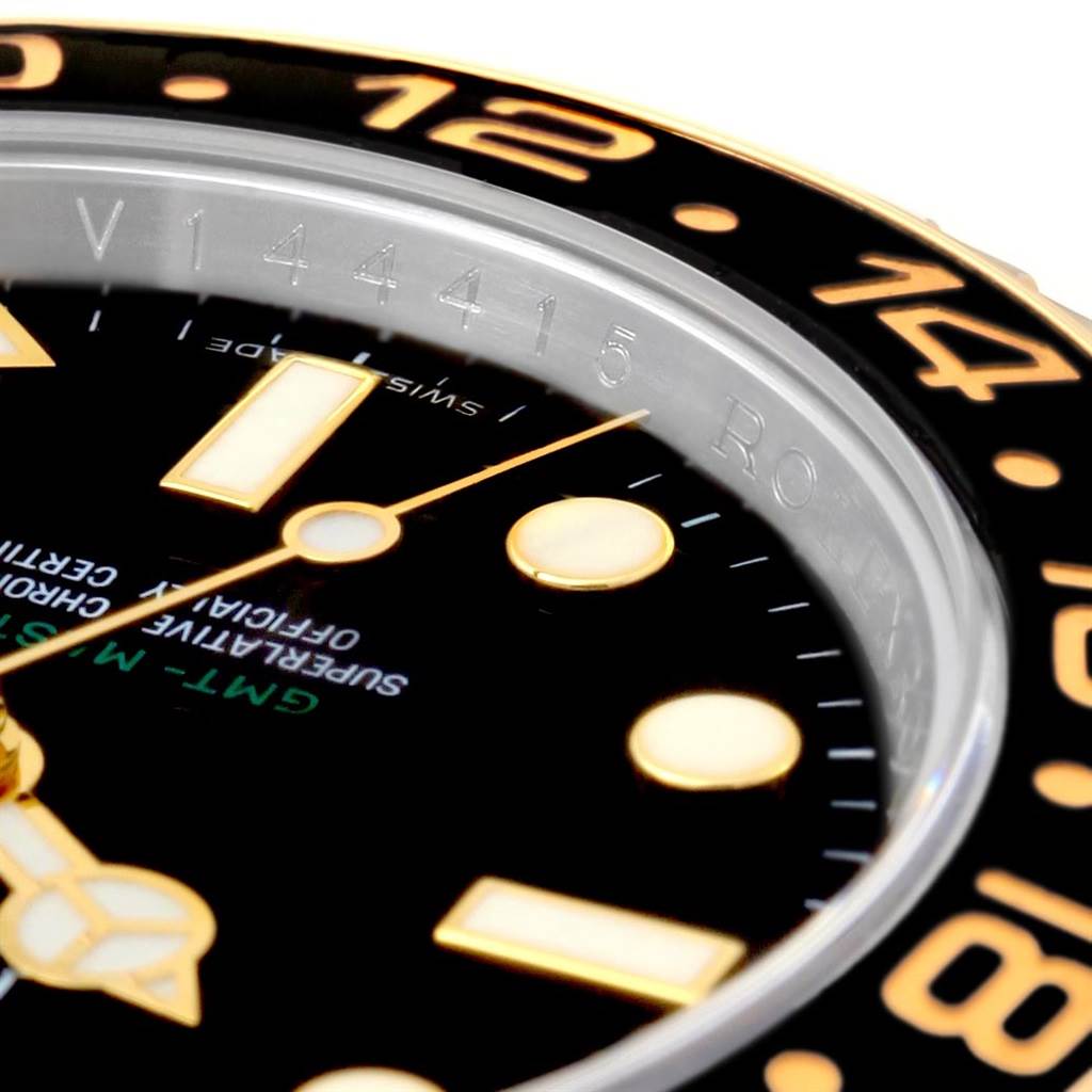 This image shows a close-up of the bezel, dial, and some markings on the Rolex GMT-Master 116713 Men
s Stainless Steel Black Dial 116713 Men
s Stainless Steel Black Dial watch.