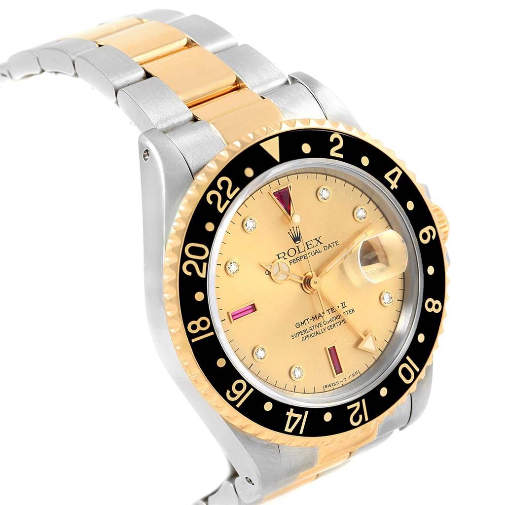 The Rolex GMT-Master 16713 Men's Stainless Steel Champagne Dial 16713 Men's Stainless Steel Champagne Dial watch is shown at an angle highlighting the face, bezel, and part of the bracelet.
