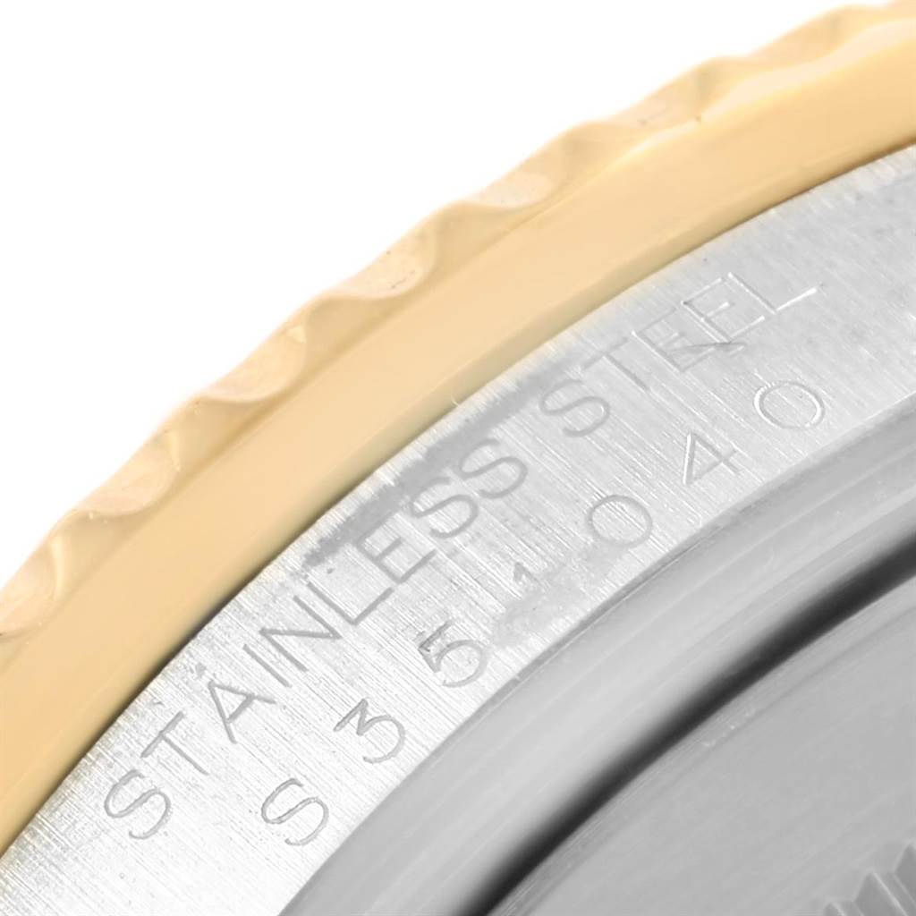 This image shows a close-up of the engraved case back of a Rolex GMT-Master 16713 Men's Stainless Steel Champagne Dial 16713 Men's Stainless Steel Champagne Dial watch, highlighting the stainless steel material.