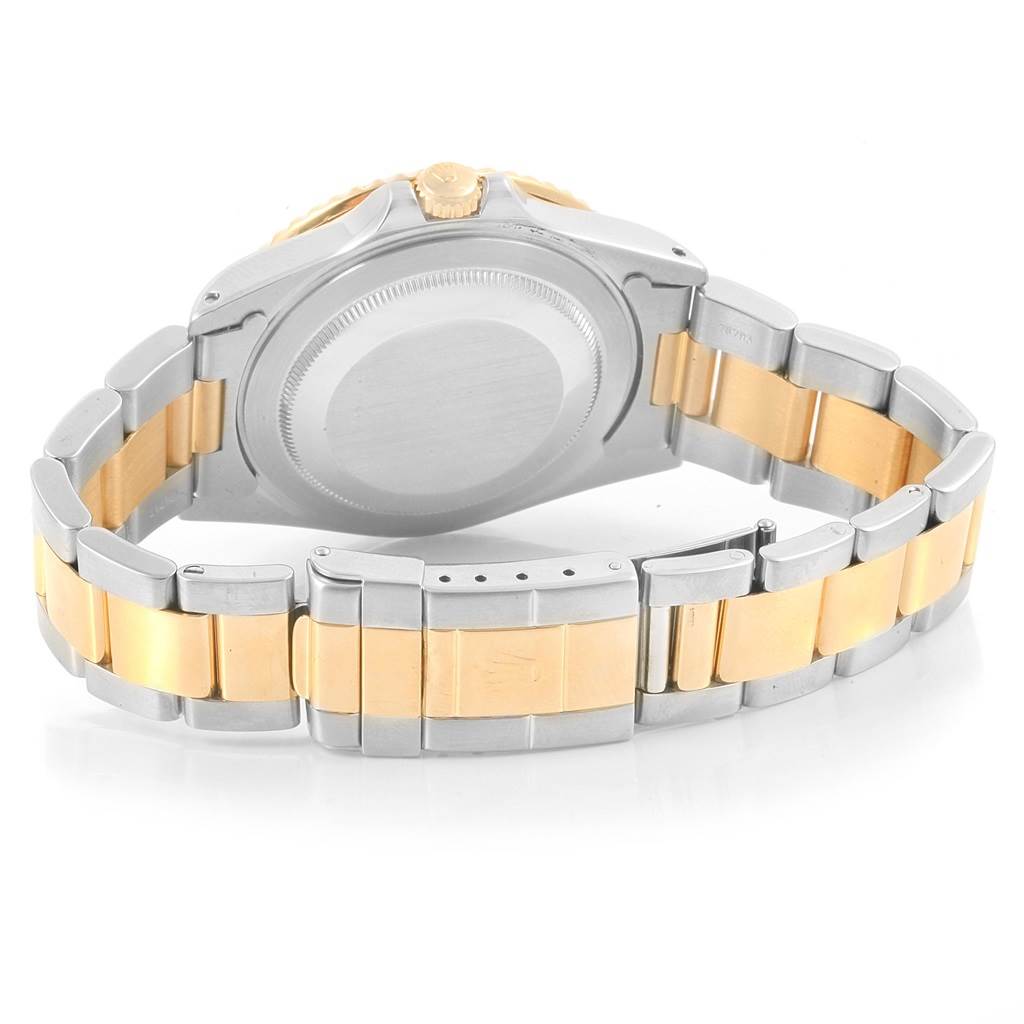 The image shows the backside of the Rolex GMT-Master 16713 Men's Stainless Steel Champagne Dial 16713 Men's Stainless Steel Champagne Dial, highlighting the case back and two-tone metal bracelet.