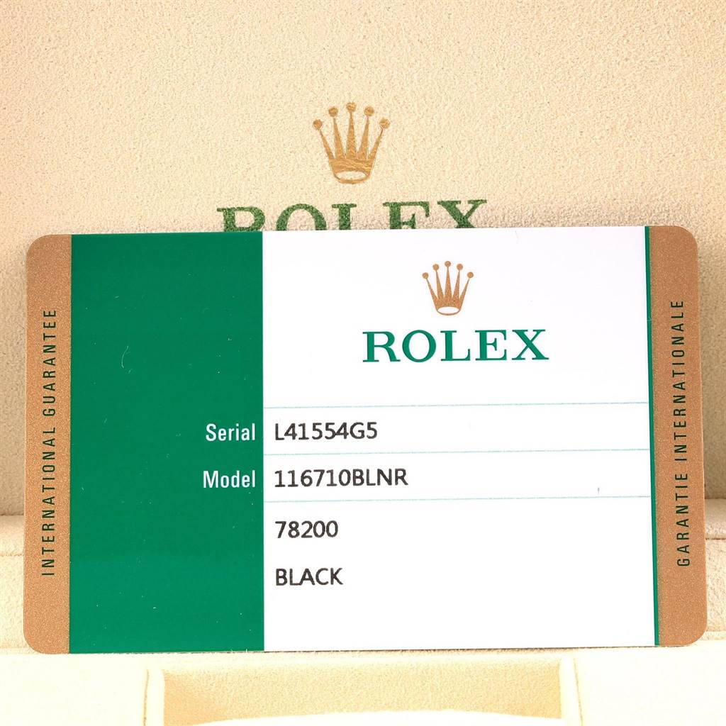 The image shows the serial, model, and other details on the warranty card of the Rolex GMT-Master 116710 Men's Stainless Steel Black Dial 116710 Men's Stainless Steel Black Dial model 116710BLNR.