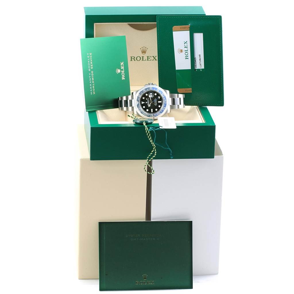 The Rolex GMT-Master 116710 Men's Stainless Steel Black Dial 116710 Men's Stainless Steel Black Dial watch is shown from the front angle, along with its original box, warranty card, and accompanying documents.