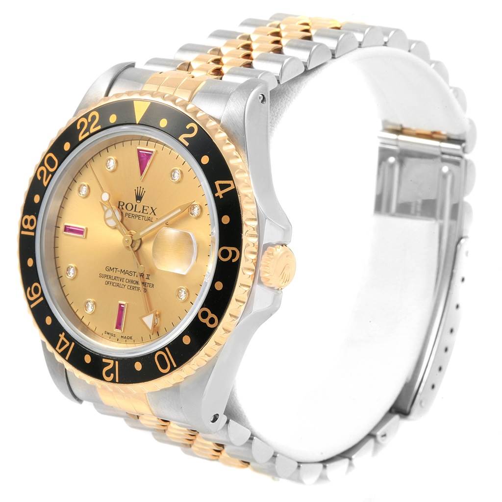 The image shows a side-angle view of a Rolex GMT-Master 16713 Men's Steel and Gold (two tone) Champagne Dial 16713 Men's Steel and Gold (two tone) Champagne Dial II watch, highlighting the bezel, dial, and two-tone bracelet.