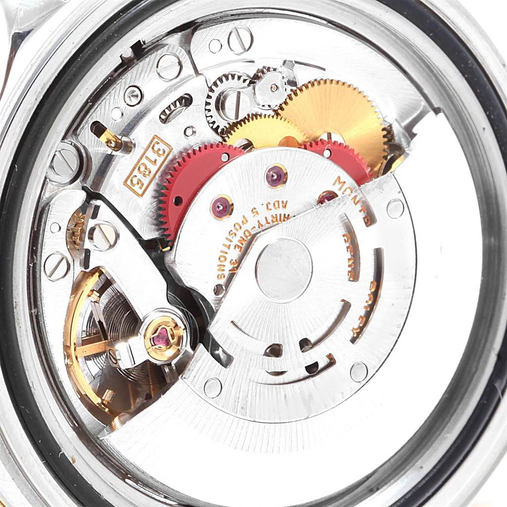 This image shows the internal movement mechanism of a Rolex GMT-Master 16713 Men's Steel and Gold (two tone) Champagne Dial 16713 Men's Steel and Gold (two tone) Champagne Dial watch from a back angle.