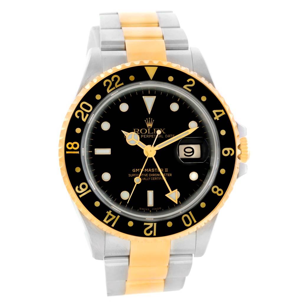 The Rolex GMT-Master 16713 Men's Stainless Steel Black Dial 16713 Men's Stainless Steel Black Dial II watch is shown from a front angle, displaying its black dial, gold bezel, and two-tone metal bracelet.