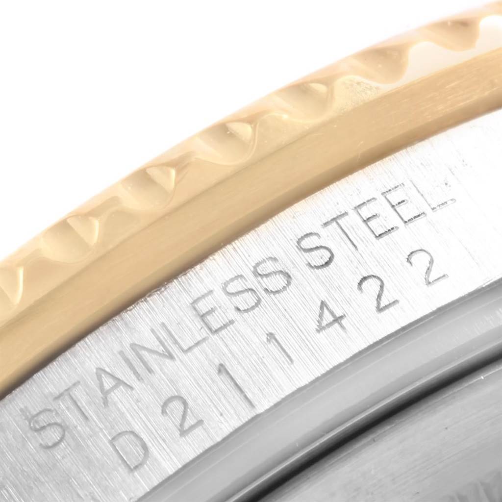 This close-up angle shows the side profile of the Rolex GMT-Master 16713 Men's Stainless Steel Black Dial 16713 Men's Stainless Steel Black Dial's bezel and its engraved serial number on the stainless steel case.