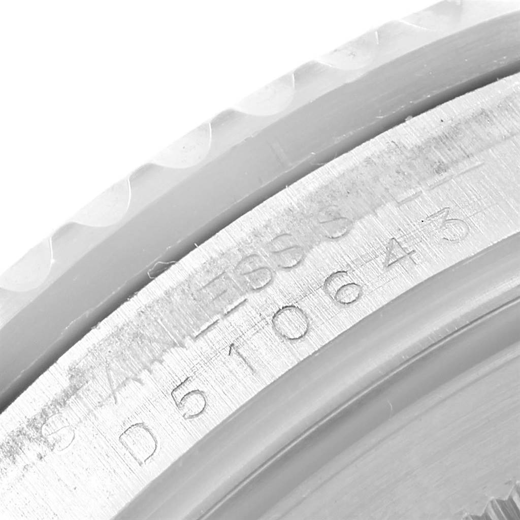 This image shows a close-up view of the case back and serial number of a Rolex GMT-Master 16710 Men's Stainless Steel Black Dial 16710 Men's Stainless Steel Black Dial watch.