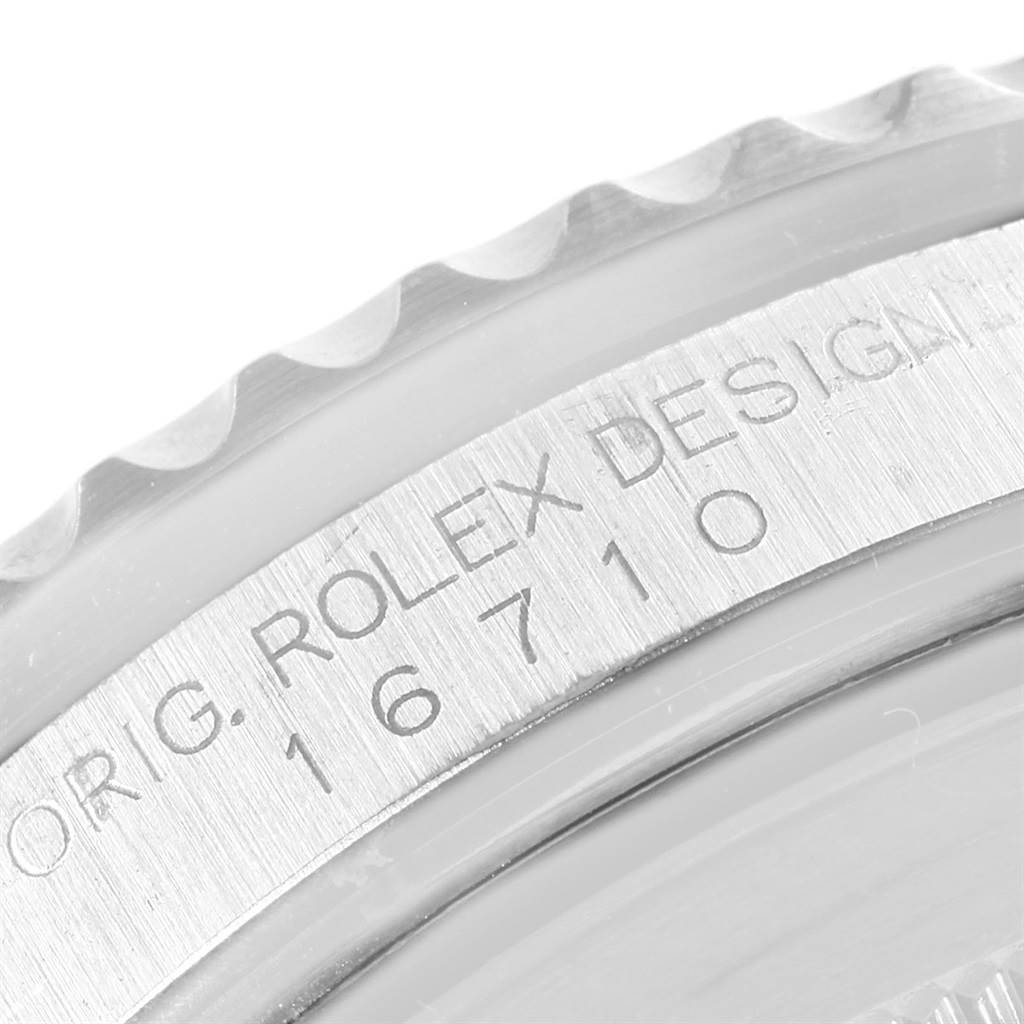 The image shows a close-up of the bezel and inner ring with the model number of a Rolex GMT-Master 16710 Men's Stainless Steel Black Dial 16710 Men's Stainless Steel Black Dial watch.